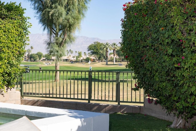 exterior space with a mountain view and a yard