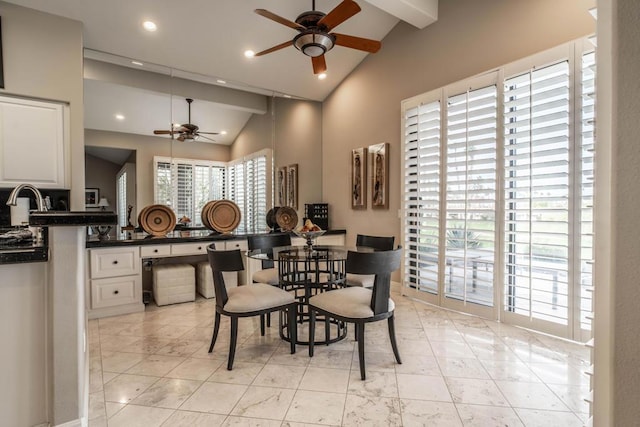 dining room featuring high vaulted ceiling and ceiling fan