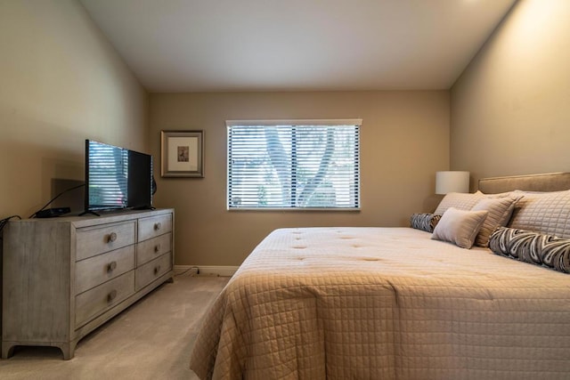 bedroom featuring light colored carpet