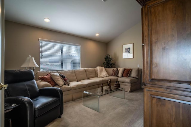 living room featuring lofted ceiling and light carpet