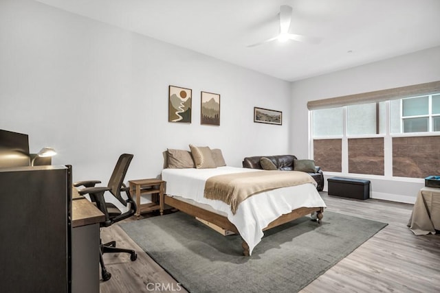 bedroom featuring ceiling fan and light hardwood / wood-style flooring