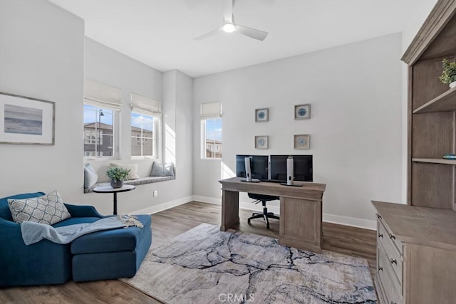 home office featuring ceiling fan and hardwood / wood-style floors