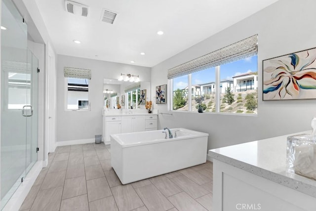 bathroom featuring shower with separate bathtub and vanity