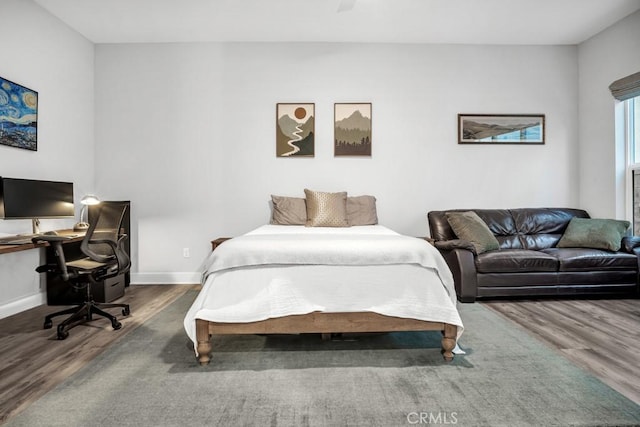 bedroom with hardwood / wood-style flooring