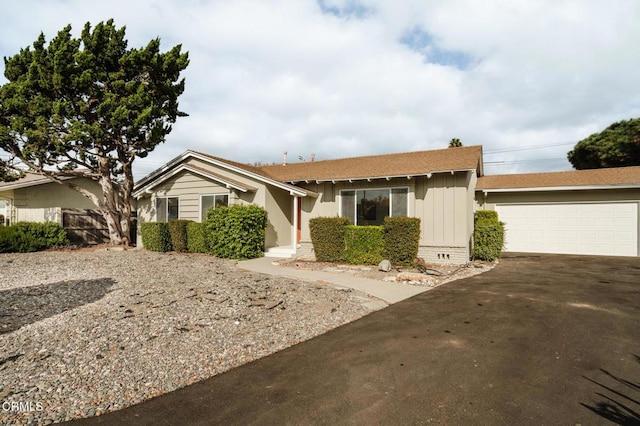 ranch-style home with a garage