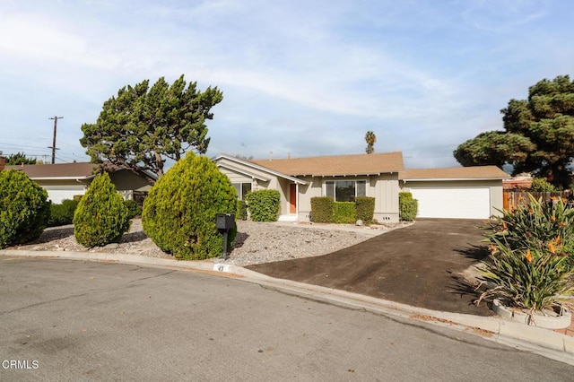 single story home featuring a garage