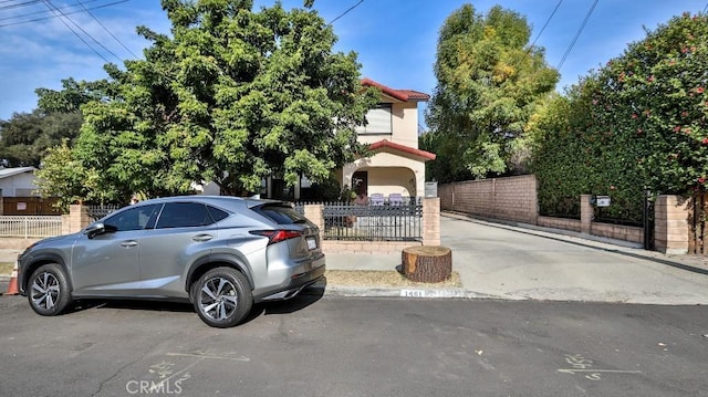 obstructed view of property featuring a garage