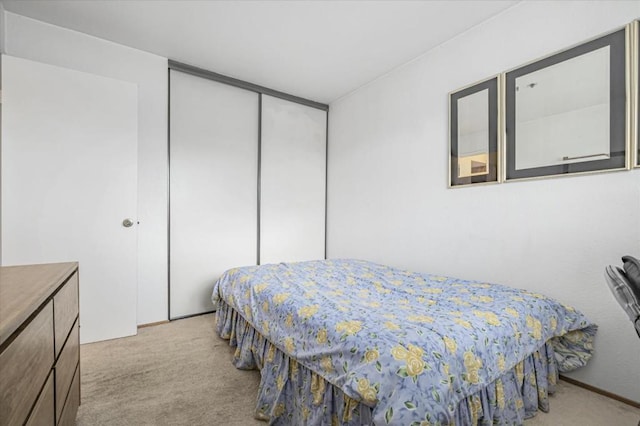 carpeted bedroom with a closet