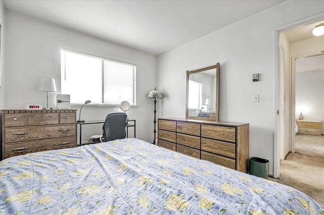 bedroom featuring light colored carpet