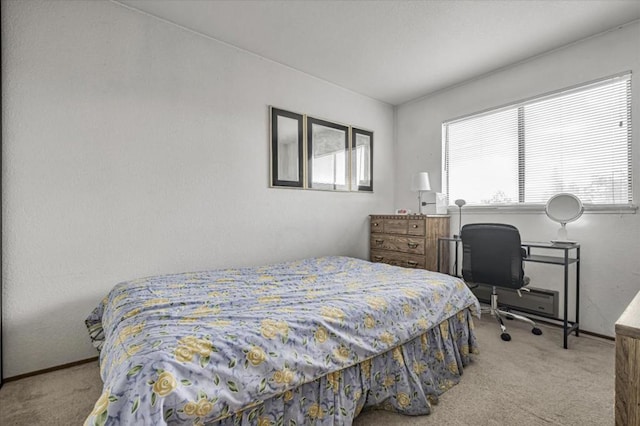 carpeted bedroom featuring multiple windows