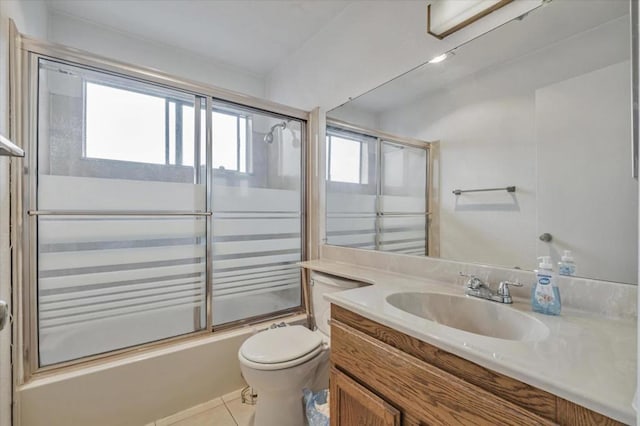 full bathroom with tile patterned floors, toilet, vanity, and combined bath / shower with glass door