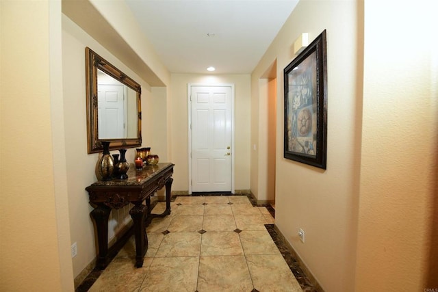 corridor with light tile patterned flooring