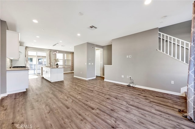 unfurnished living room featuring light hardwood / wood-style flooring