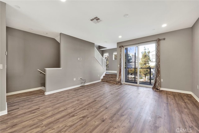 unfurnished living room featuring wood-type flooring