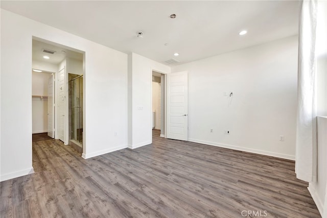 spare room featuring wood-type flooring