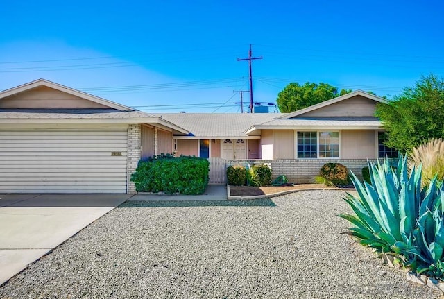 single story home featuring a garage