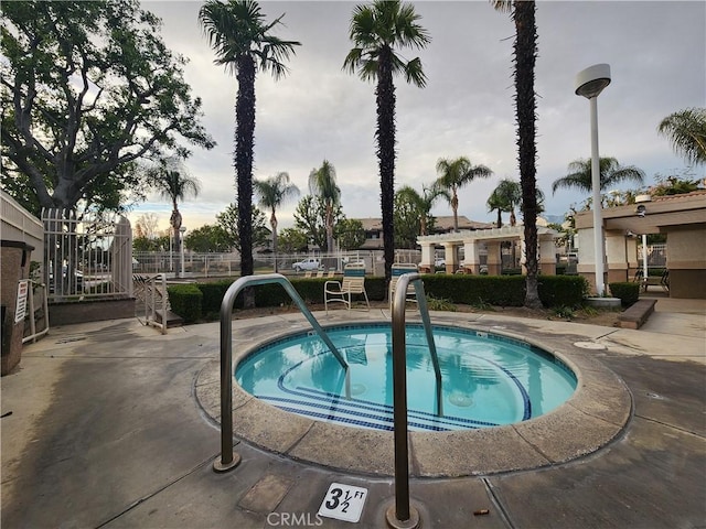 912 N Turner Ave Unit 58, Ontario, CA 91764 - view of pool with a community hot tub and fence