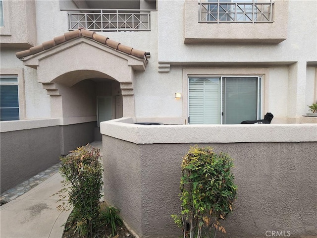 912 N Turner Ave Unit 58, Ontario, CA 91764 - doorway to property with stucco siding