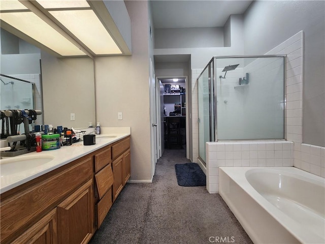912 N Turner Ave Unit 58, Ontario, CA 91764 - full bathroom featuring a walk in closet, a shower stall, a sink, a garden tub, and double vanity