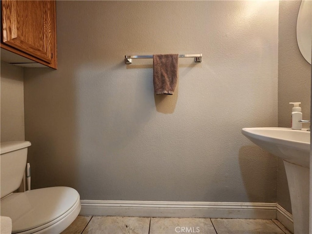 912 N Turner Ave Unit 58, Ontario, CA 91764 - half bathroom with toilet, tile patterned flooring, and baseboards