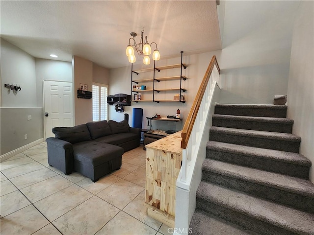 912 N Turner Ave Unit 58, Ontario, CA 91764 - living area with baseboards, a notable chandelier, stairway, and light tile patterned floors