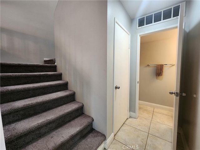 912 N Turner Ave Unit 58, Ontario, CA 91764 - staircase featuring baseboards, visible vents, and tile patterned flooring