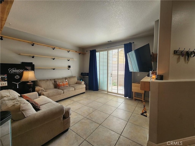 912 N Turner Ave Unit 58, Ontario, CA 91764 - living room with light tile patterned floors, visible vents, and a textured ceiling