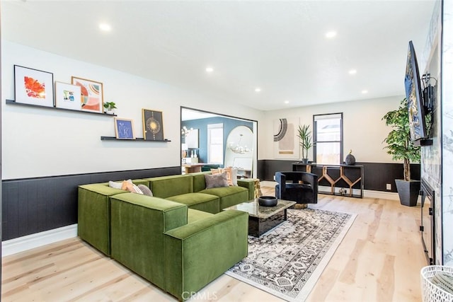 living room featuring a fireplace and light hardwood / wood-style floors