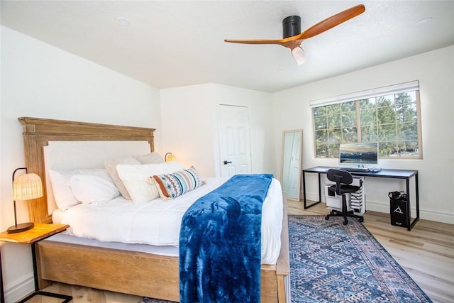 bedroom featuring ceiling fan and light hardwood / wood-style floors