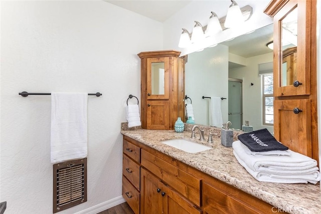 bathroom with wood-type flooring and vanity