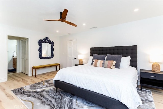 bedroom with ceiling fan and light hardwood / wood-style floors