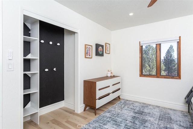 interior space featuring light hardwood / wood-style floors and ceiling fan