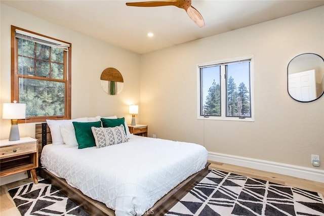 bedroom featuring ceiling fan and hardwood / wood-style flooring