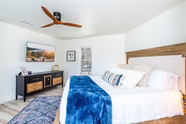 bedroom featuring hardwood / wood-style flooring and ceiling fan