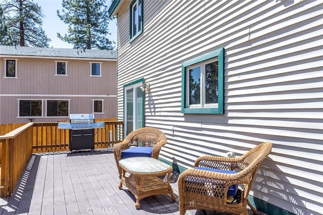 wooden terrace with area for grilling