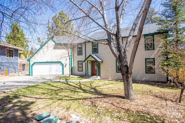 view of front facade with a garage and a front lawn