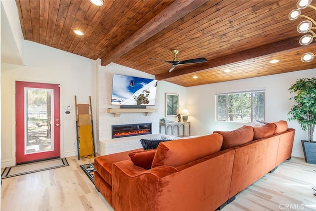 living room with beam ceiling, light hardwood / wood-style flooring, and wood ceiling