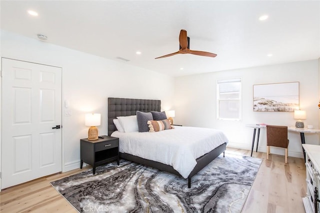 bedroom featuring light hardwood / wood-style flooring and ceiling fan