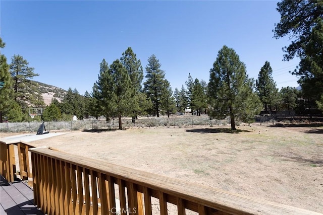 view of yard featuring a wooden deck