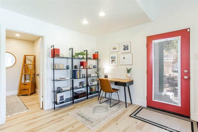 office area with light hardwood / wood-style floors