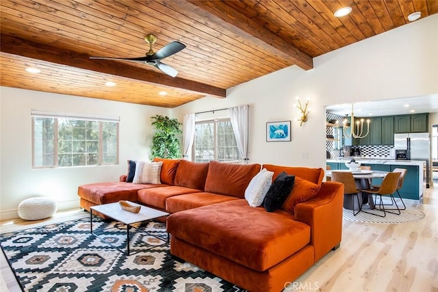 living room with beamed ceiling, wood ceiling, ceiling fan with notable chandelier, and light wood-type flooring