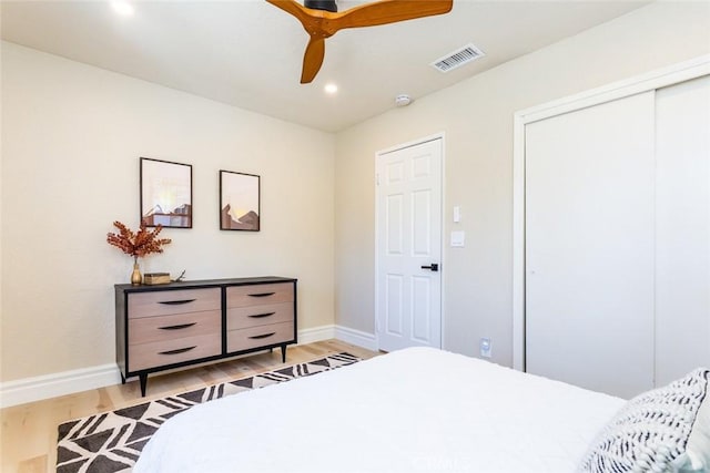 bedroom featuring ceiling fan and light hardwood / wood-style floors