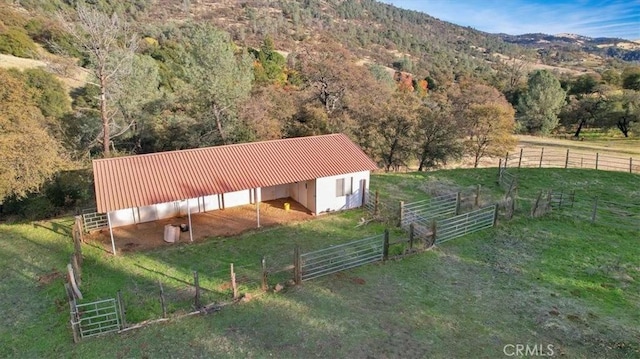 birds eye view of property featuring a mountain view and a rural view