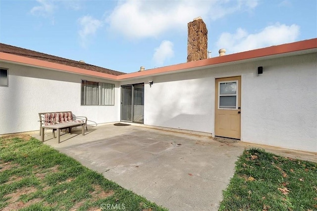 rear view of house with a patio area