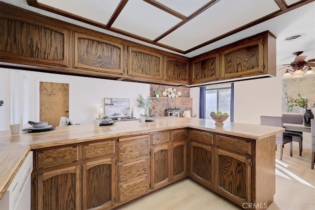 kitchen featuring kitchen peninsula and ceiling fan