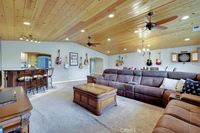 living area featuring arched walkways, light carpet, lofted ceiling, and recessed lighting