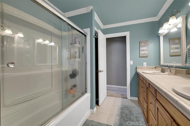 bathroom featuring double vanity, ornamental molding, a sink, and tile patterned floors