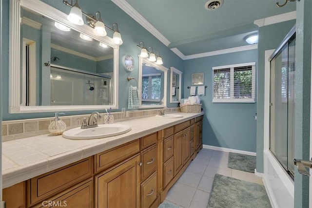 bathroom featuring ornamental molding, a sink, and visible vents