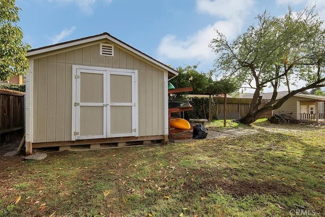 view of shed featuring a fenced backyard