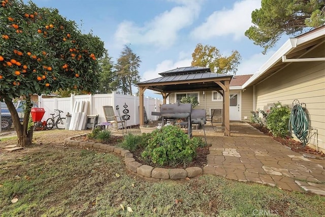 view of yard with a gazebo, a patio area, and fence